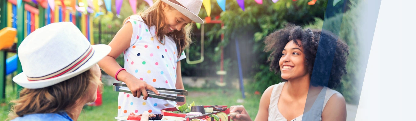 Couple at backyard BBQ with daughter