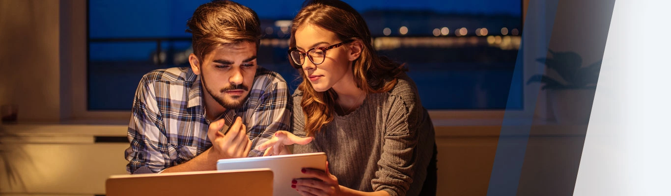 Couple looking at digital tablet