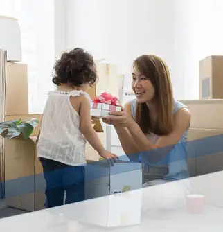 Mother and daughter with moving boxes