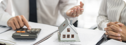 Woman cheering as she enters new home with boxes Woman cheering as she enters new home with boxes