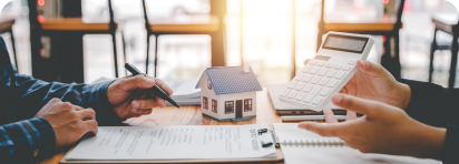 photo of family with home cardboard lifted above