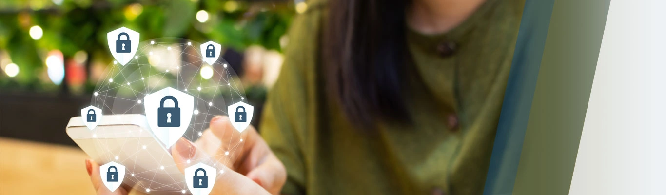 Hand holding cell phone with symbols of digital security