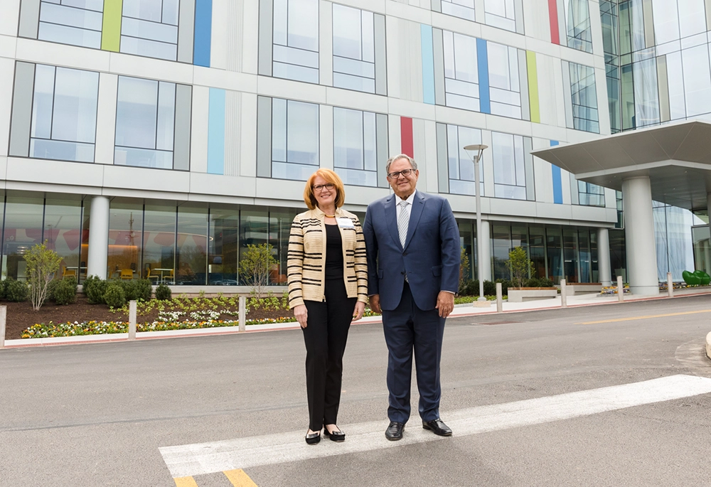 Stan and Madeline Bell, CEO of the Children's Hospital of Philadelphia (CHOP), in front of the Middleman Family Pavilion