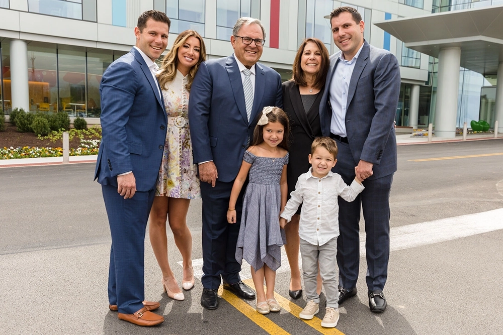 Stan with wife, sons, daughter-in-law, and grandchildren at the Middleman Family Pavilion