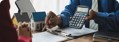 photo of family with home cardboard lifted above