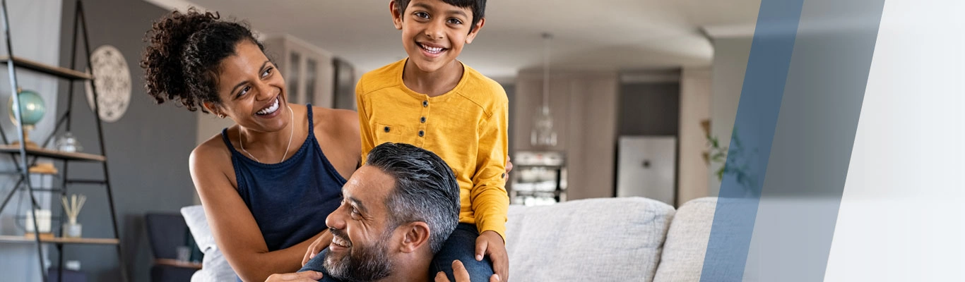 Playful smiling family in living room