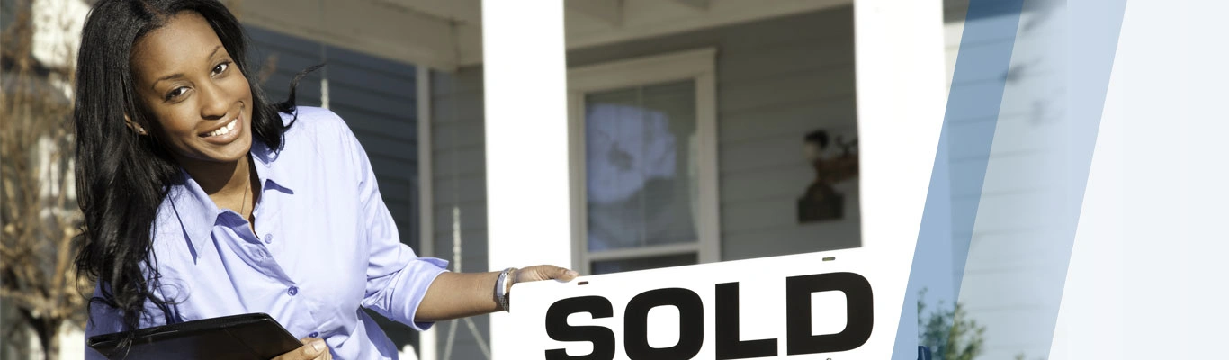 Realtor with sold sign photo